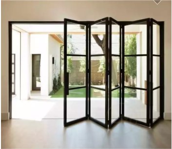 Large bifold door connecting interior space to courtyard